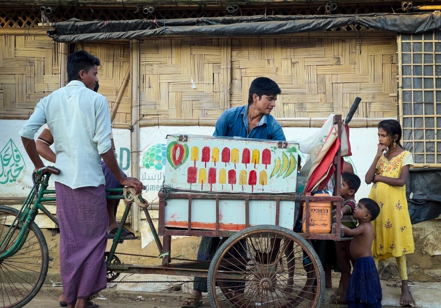 A local ice-cream vendor and children in a refugee camp in Cox's Bazar.
