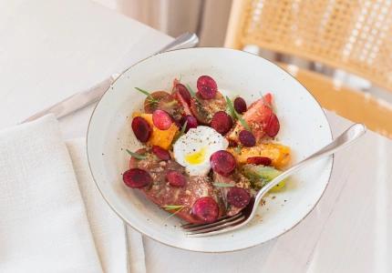 <p>Pipis Kiosk’s heirloom tomato salad with whipped silken tofu and cherry dressing</p>
